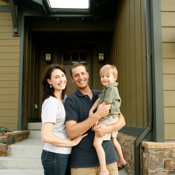 Image showing a homeowners admiring their freshly painted house exterior in San Antonio, TX.