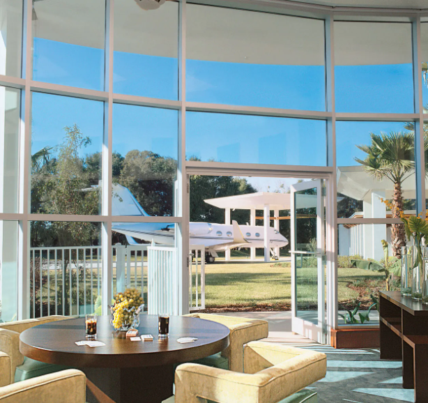 Curved Window Glass Walls Defining the Great Room