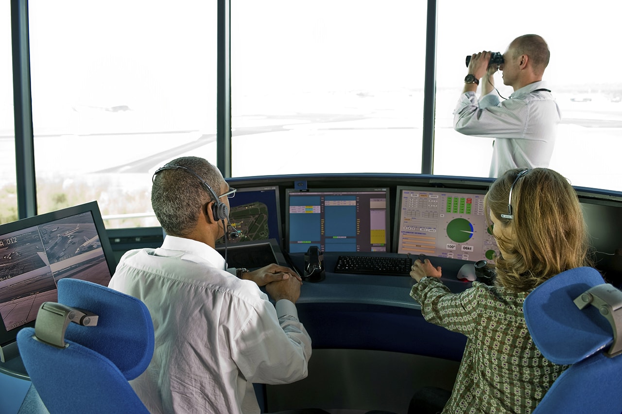 An image depicting air traffic control operations managing flight paths for planes flying at various altitudes.