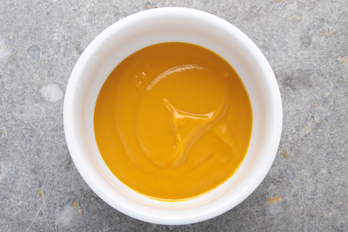 Chicken puree baby food in a white bowl
