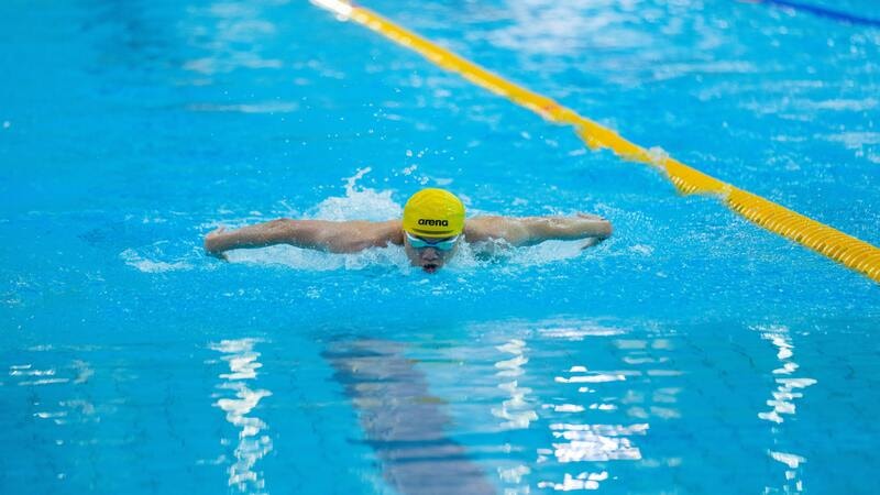 Bright swim caps enhance visibility in pools