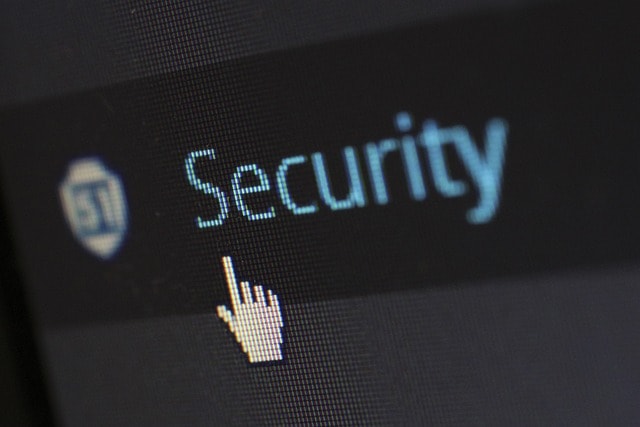 Cursor hovering over the word 'Security' on a digital screen, emphasizing the importance of online safety and protection.