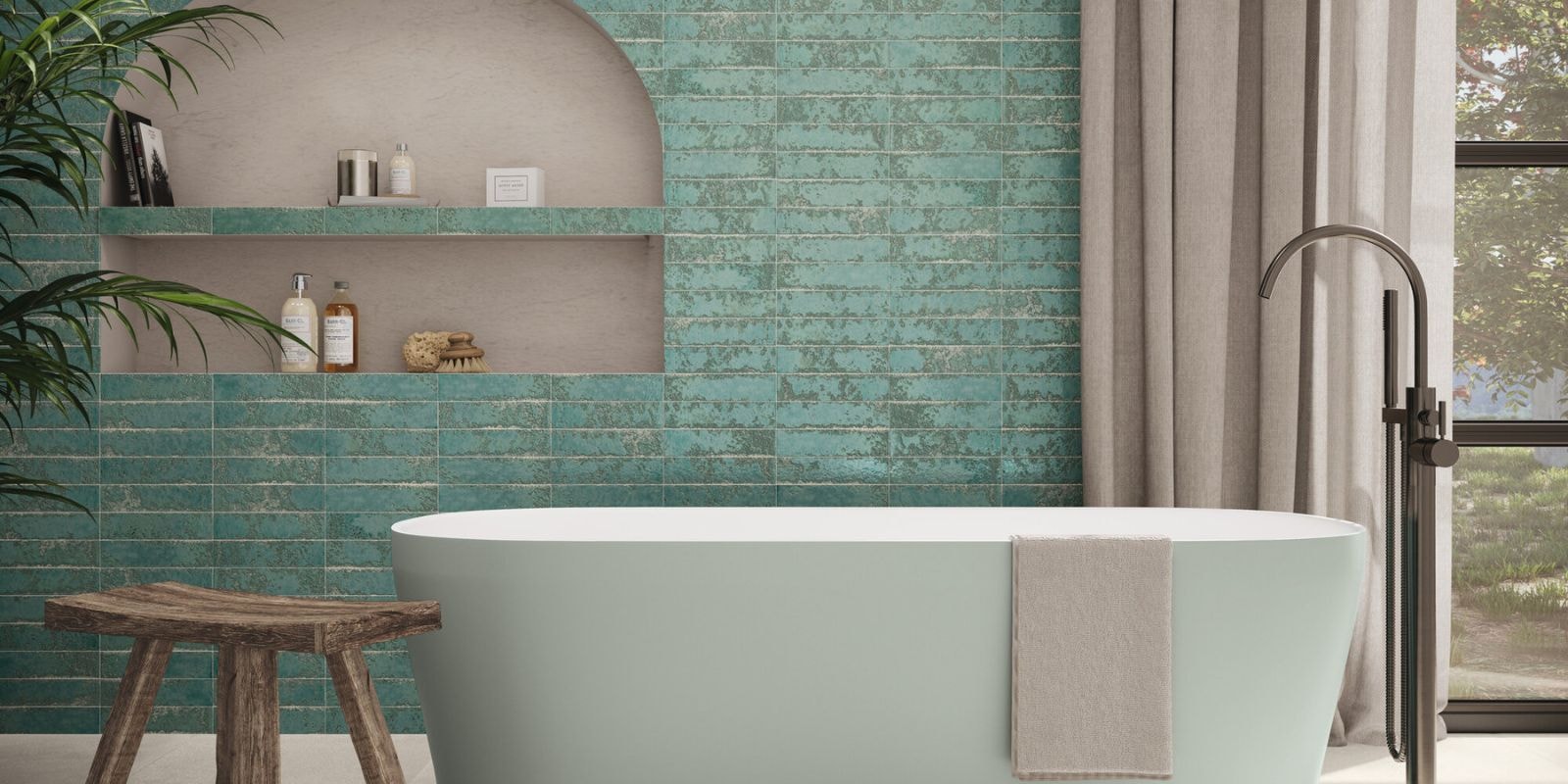 Green rustic earth toned bathroom with free standing bathtub.