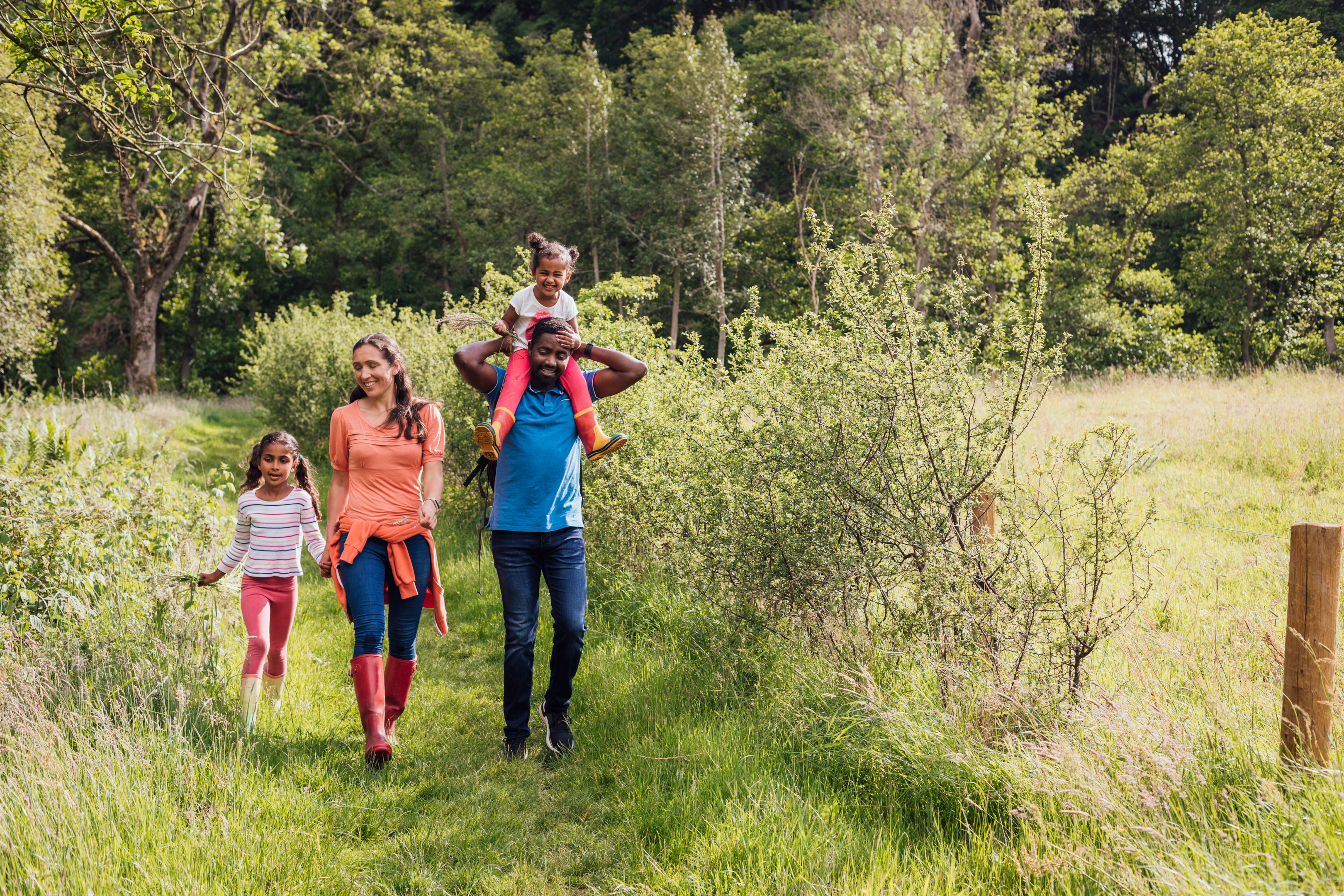 Happy family walking through Oklahoma's scenic hiking trails 