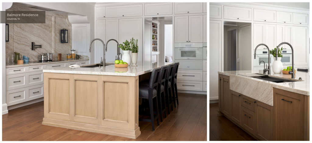 a white, beige, and black kitchen with a large island and prominent slabs