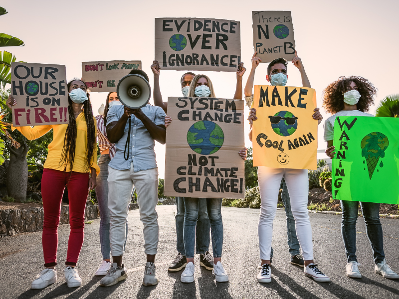 People participating in on-the-ground efforts to demonstrate their eco-activism.