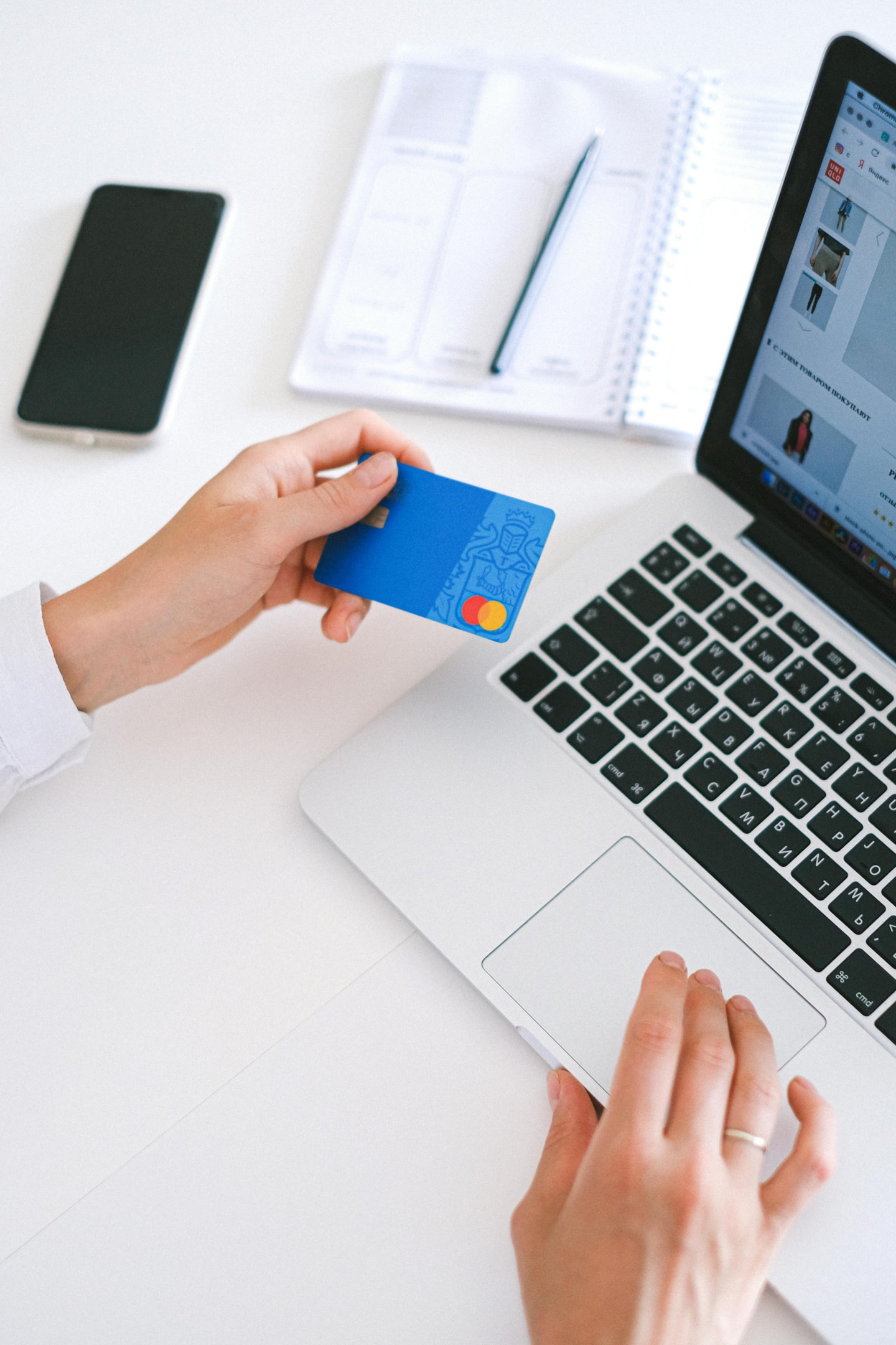 Real estate investor reviews card information used for paying contractors on various projects. 