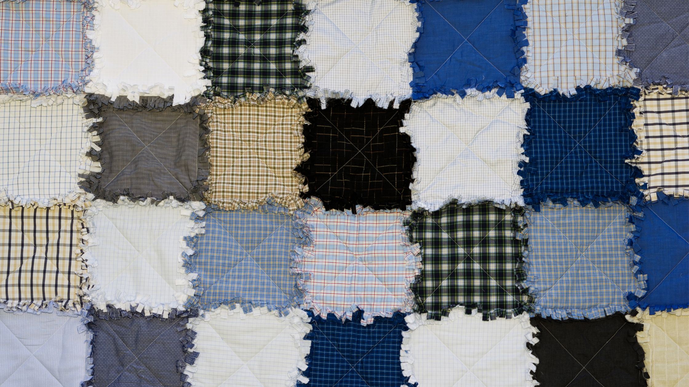 Patchwork quilt made from departed's clothing.