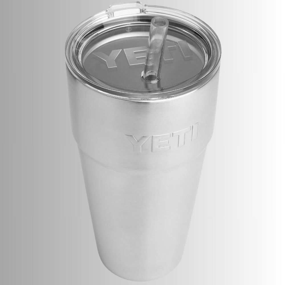 A Yeti Rambler tumbler with stainless steel body and a straw lid