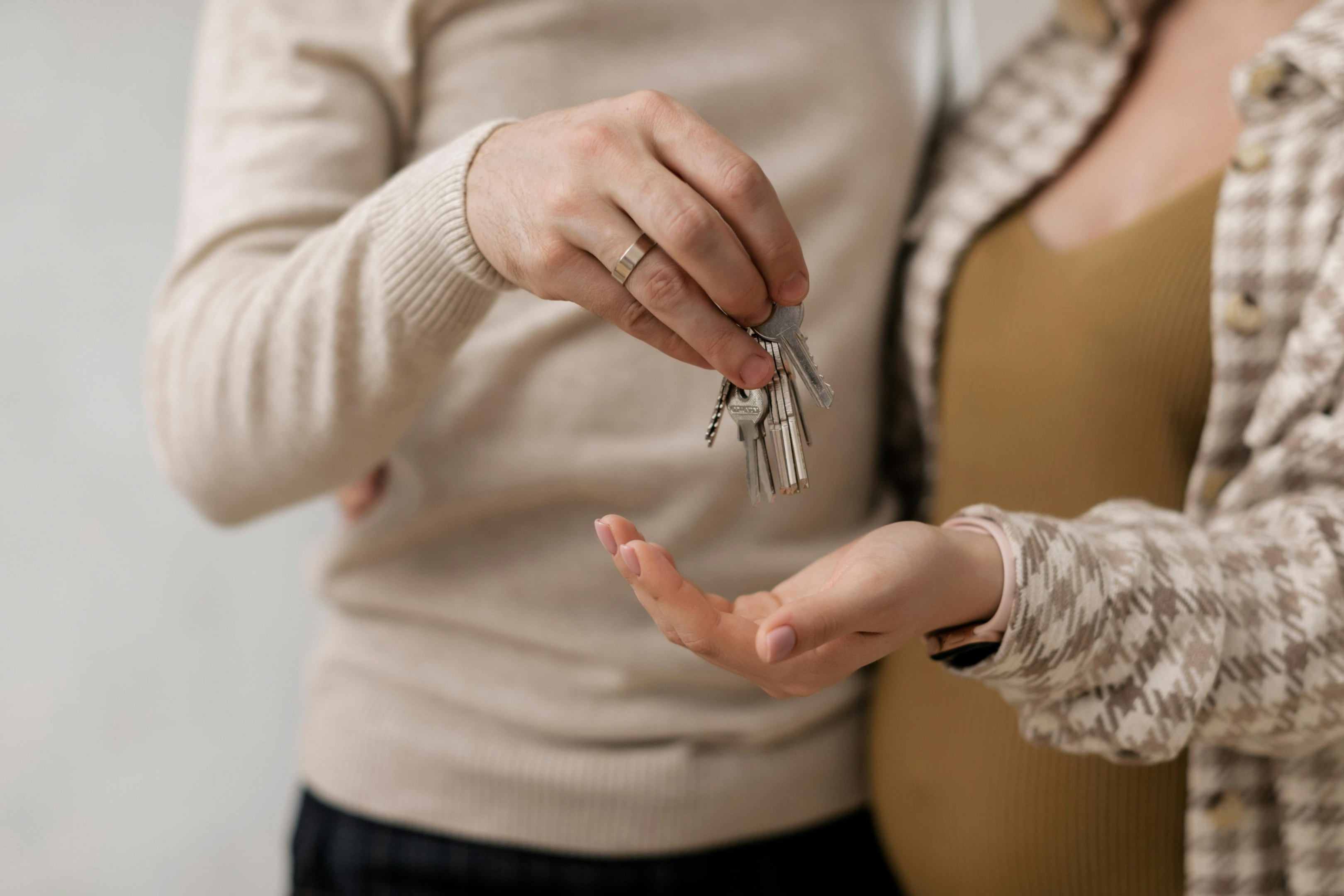 Real estate investors hold keys to newly purchased off-market property.