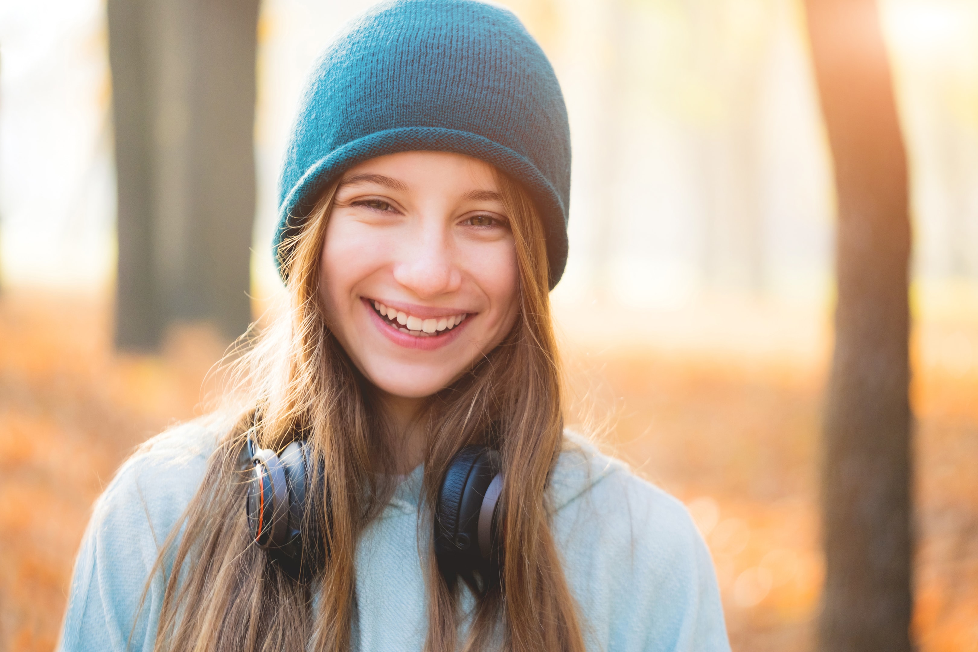 Kid smiling with straight teeth after orthodontic braces treatment