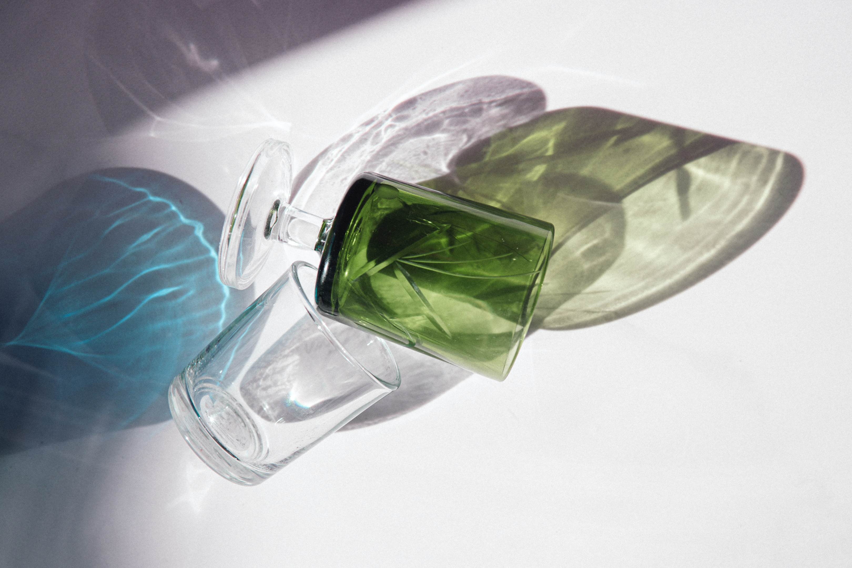 rich jewel toned greens shown through opaque glassware a key home decor trends for 2023