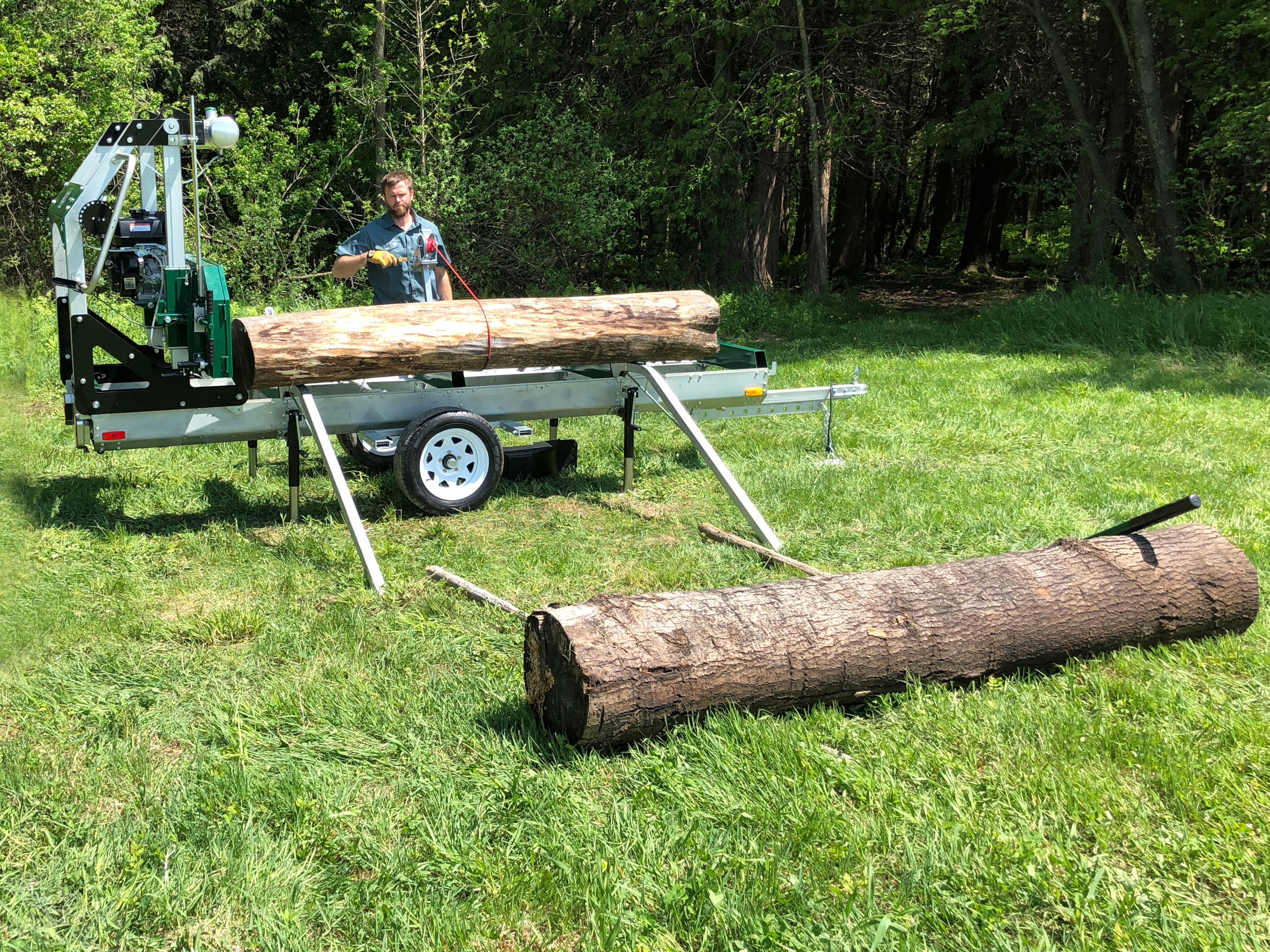 The Woodland Mills Ramp and Winch Kit, used to haul logs onto a sawmill bed, even if it's on a trailer. 