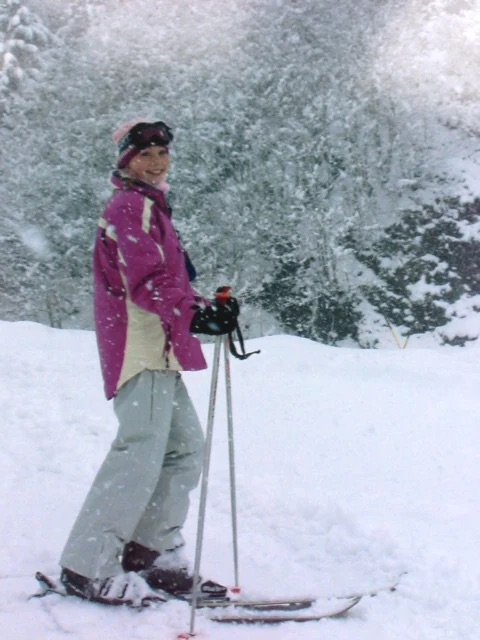 Woman on skiis near a range