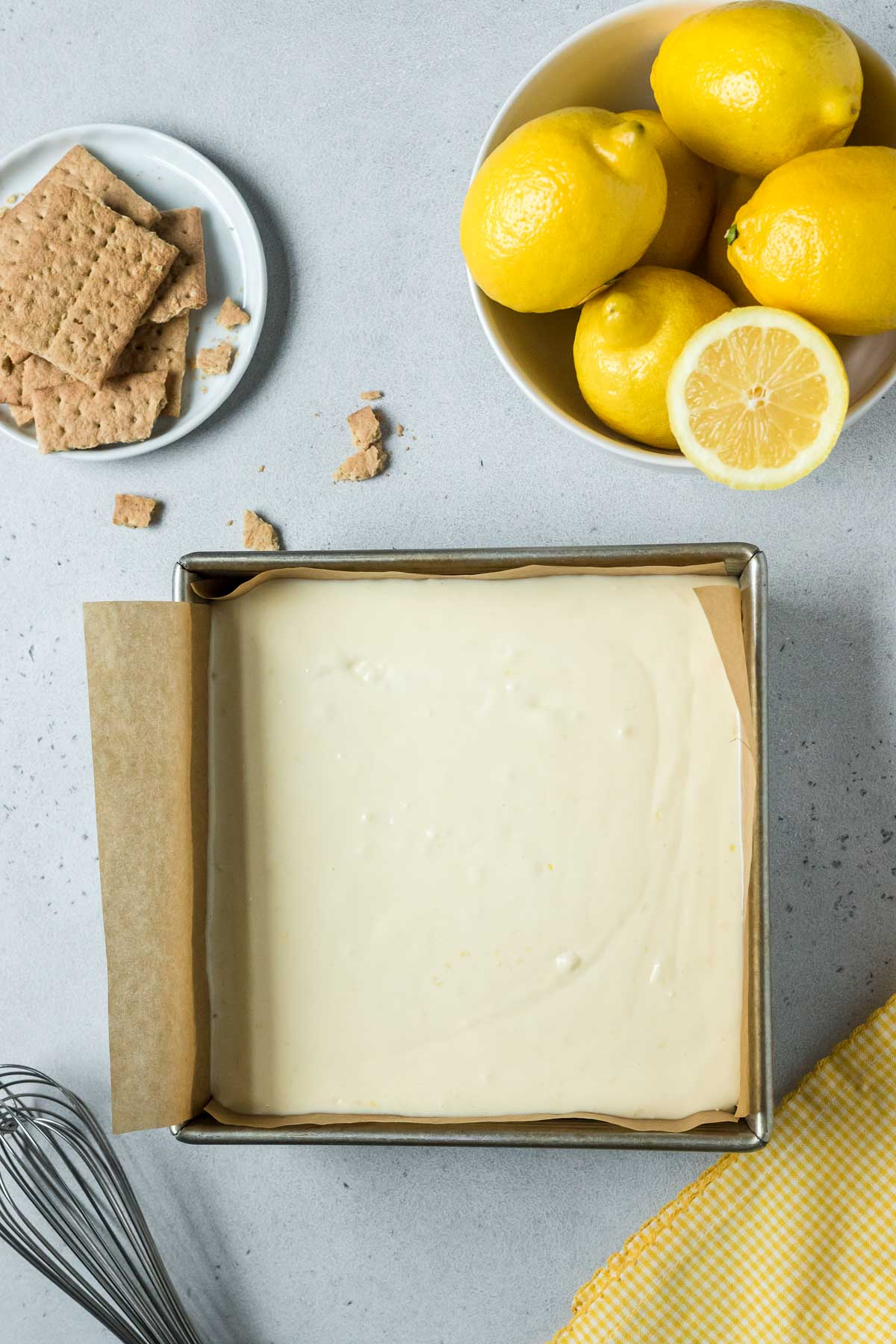 lemon cheesecake bars in baking dish