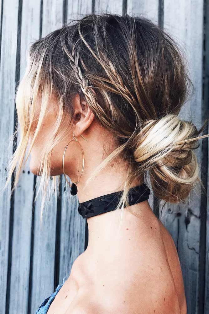 A boho chic prom hairstyle with a braided bun