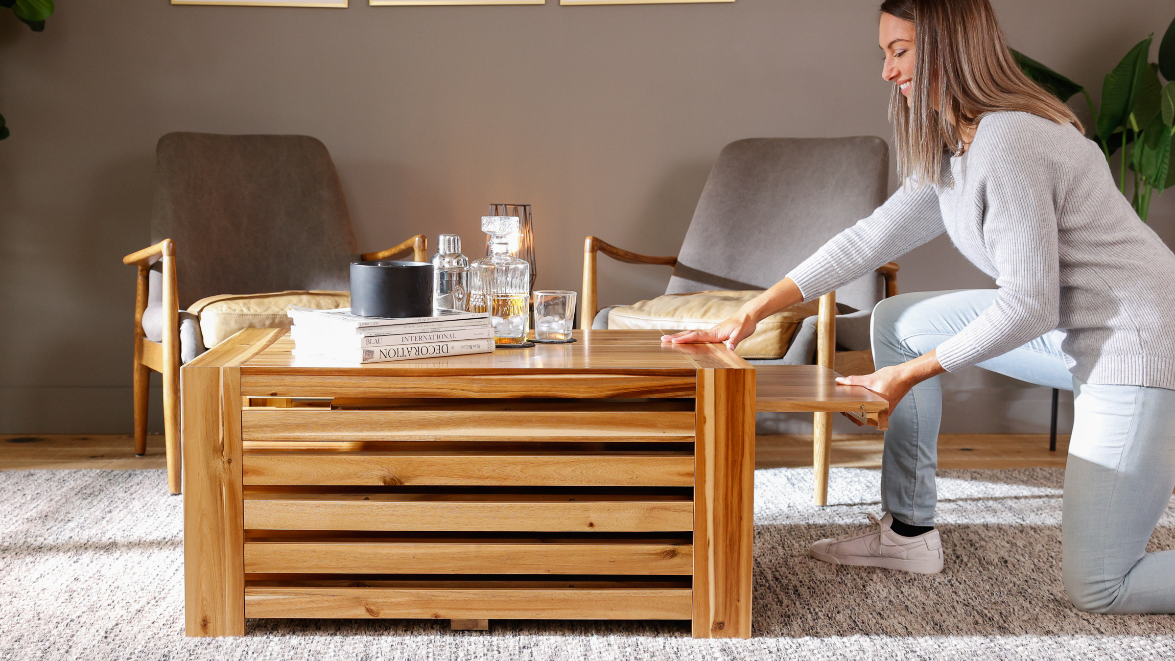A lady looking at a wooden coffee table