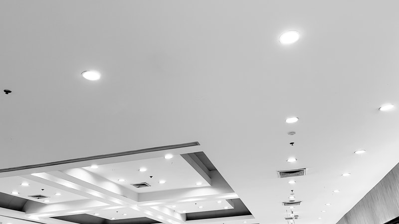 Ceiling with recessed LED downlights in a commercial interior space