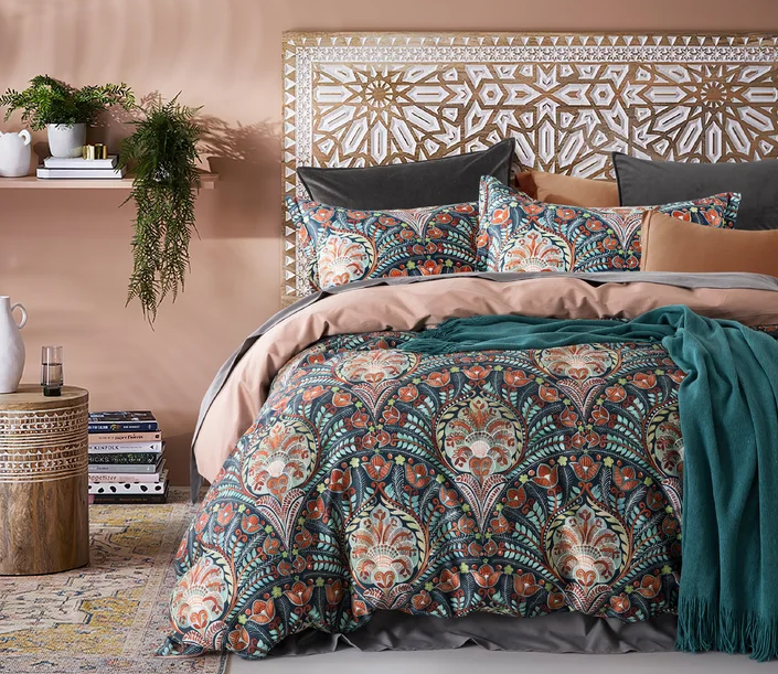 patterned bedding and unique designed headboard