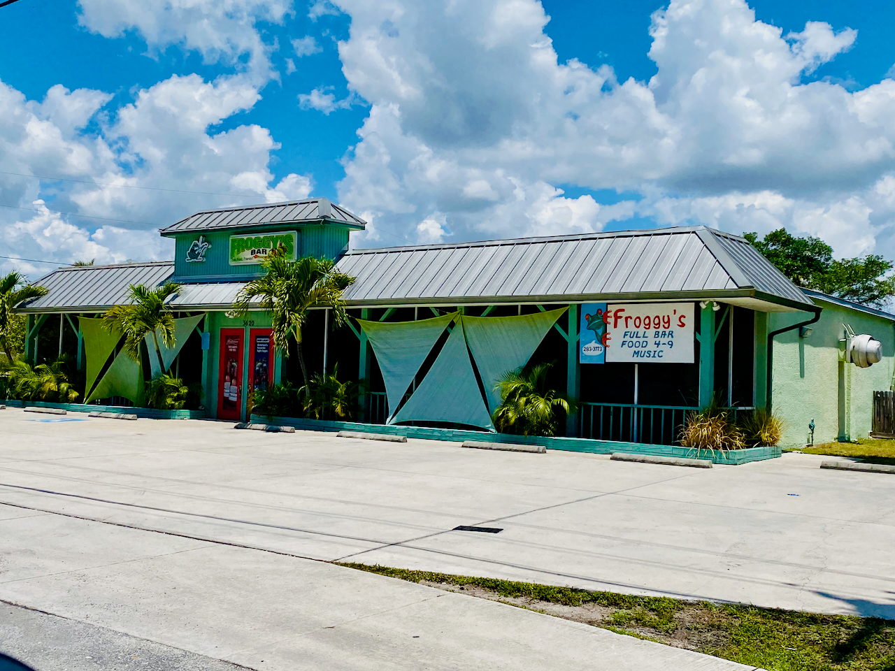 Exterior photo of the green Froggy's building, one of the favorite things to do on Pine Island.  