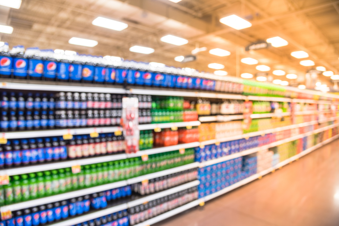 Supermarket aisle filled with a range of functional and non alcoholic drink options