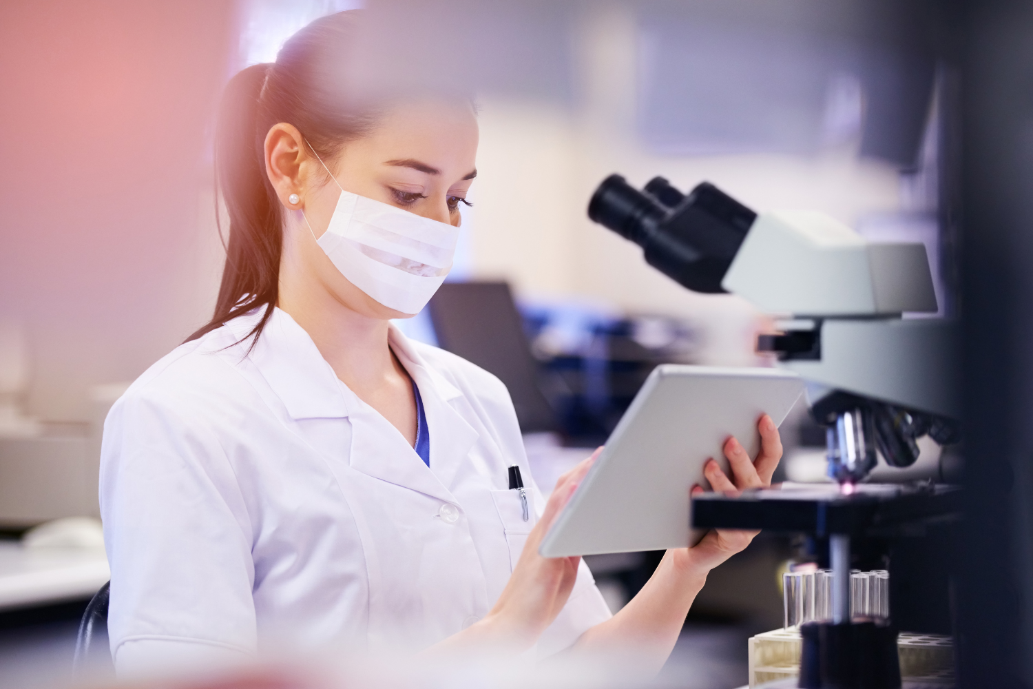 Lab tech doing some inspection in a lab.