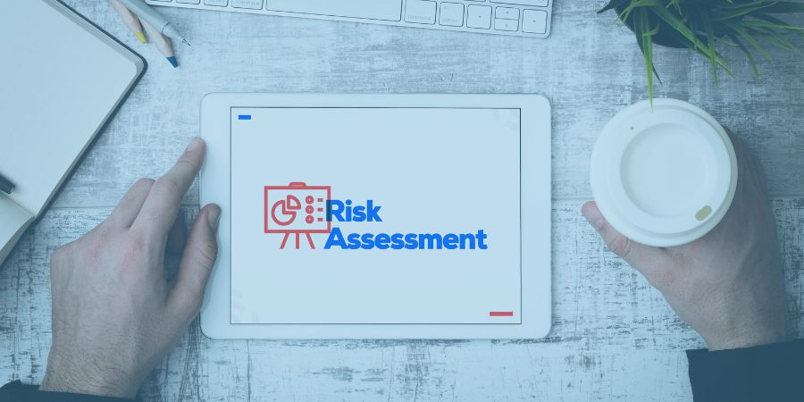 man looking at risk assessment on ipad