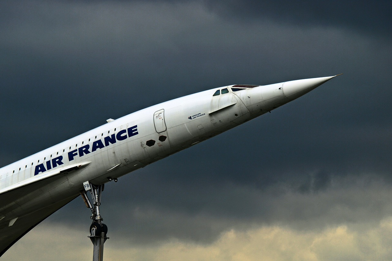 Concorde aircraft propped up on poles for display.