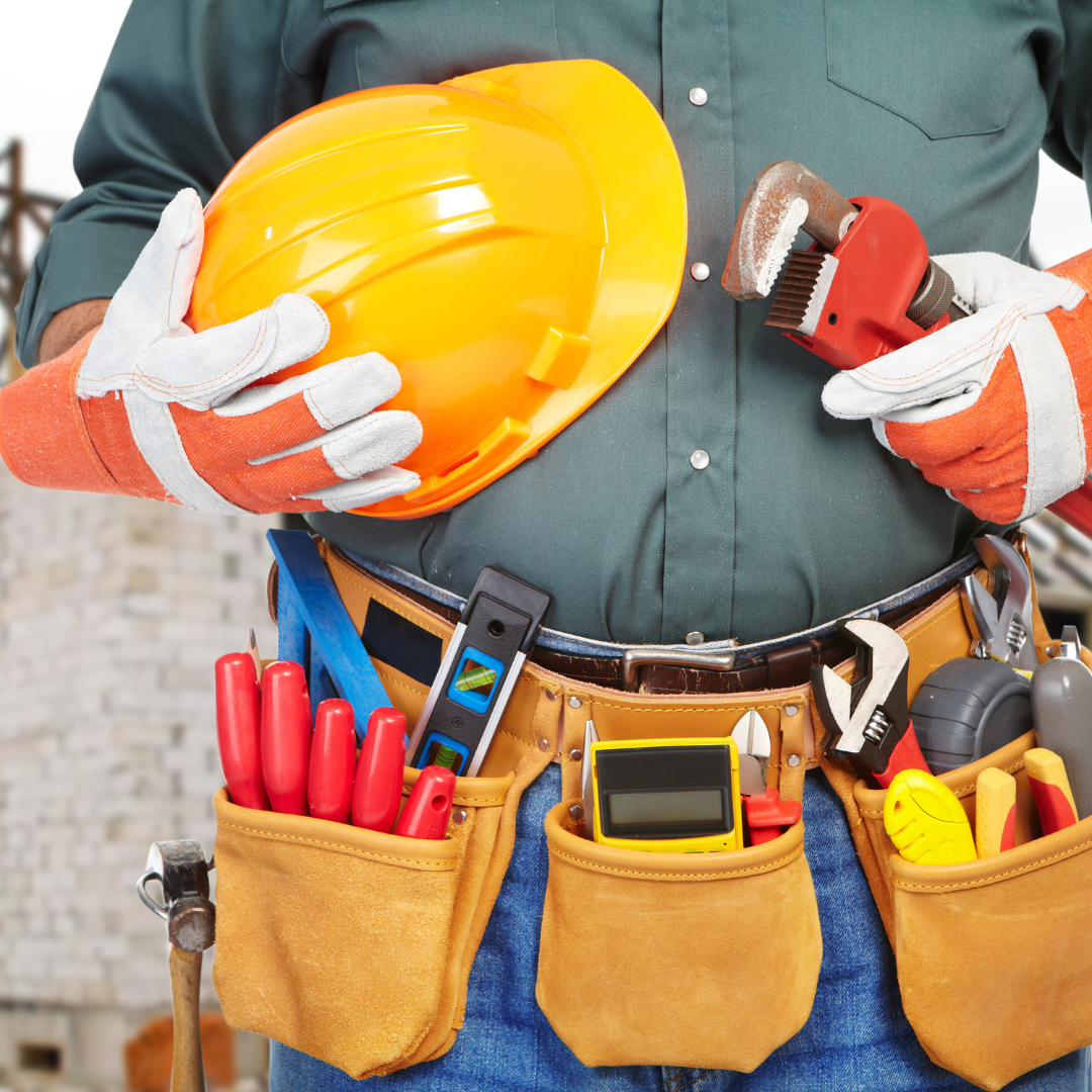 construction worker with a tool belt and safety hat