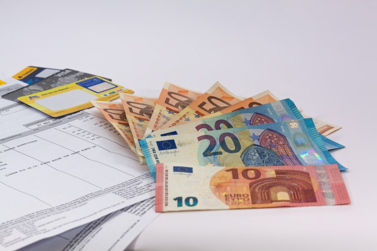 Insurance document with euro banknotes