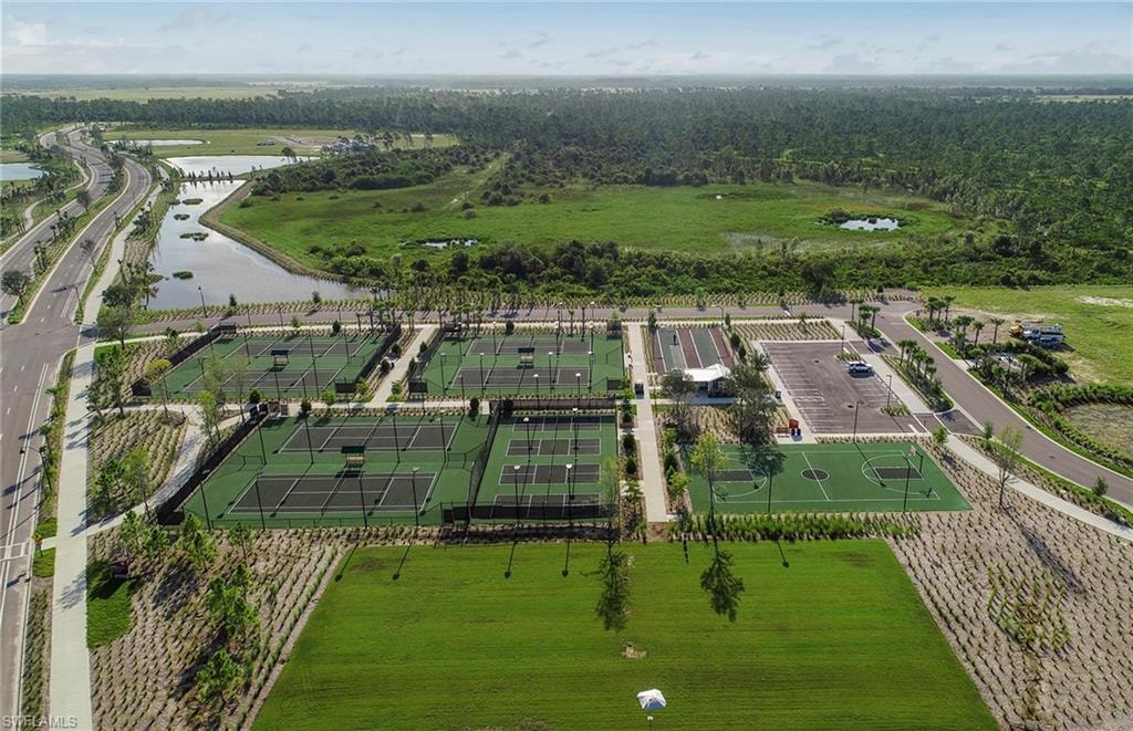The image depicts community trails meandering through lush green spaces and residential neighborhoods in Babcock Ranch, Florida, showcasing the town's commitment to preserving nature and promoting outdoor recreation for residents and visitors alike. These scenic pathways offer opportunities for hiking and exploring the natural beauty of the Babcock Ranch Preserve, enhancing the community's connection to its environment.