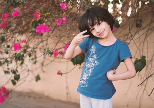 Child in a floral t-shirt. A blank t-shirt like this one offers a range of customizable options. 