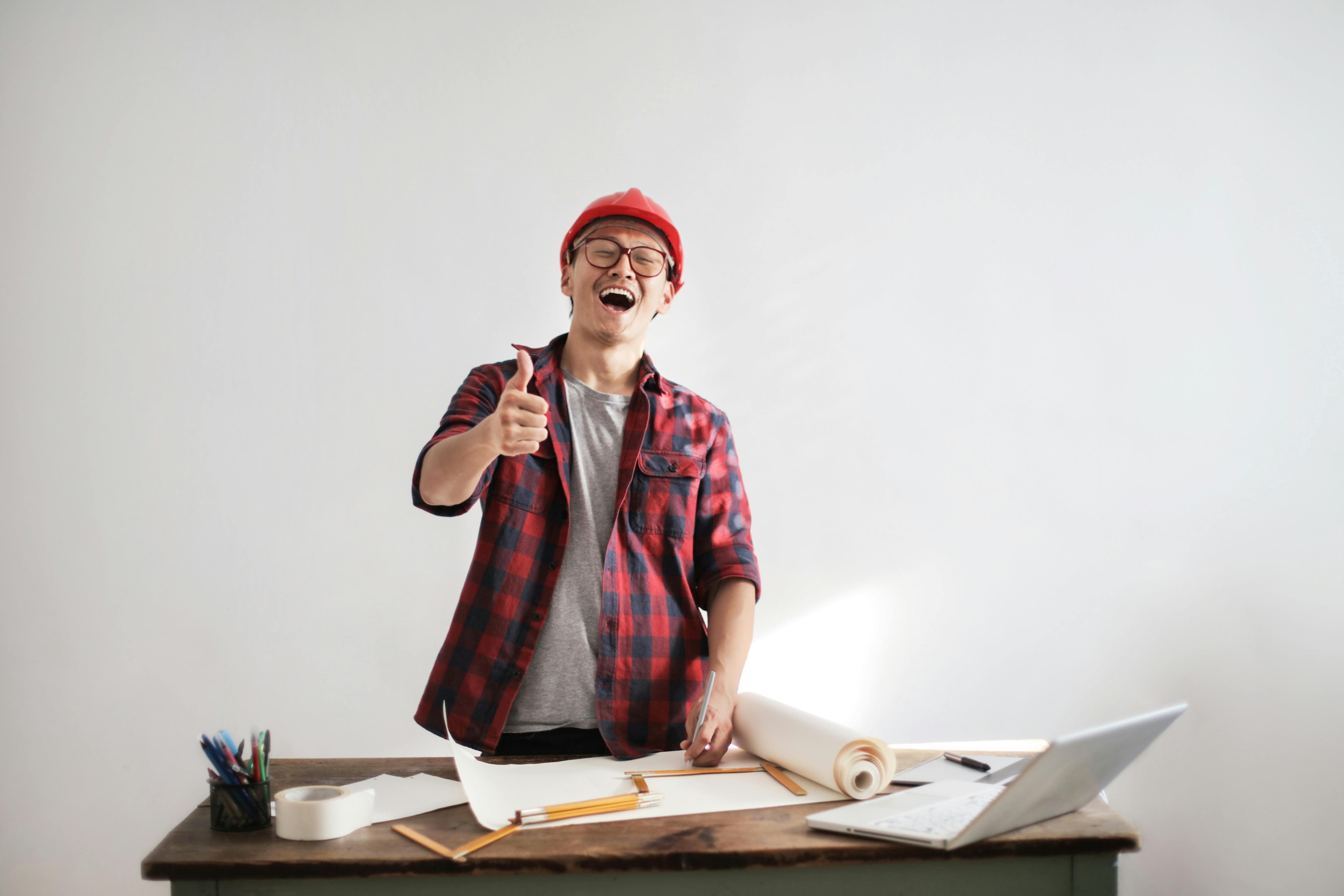 Licensed contractor gives thumbs up while working on a project for a local real estate investor. 