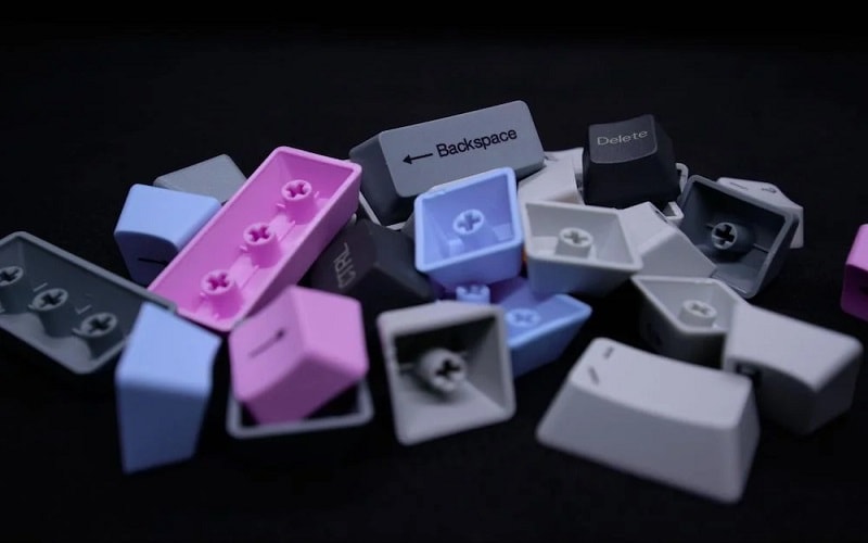 Polybutylene terephthalate (PBT) can be injection molded for keyboard caps