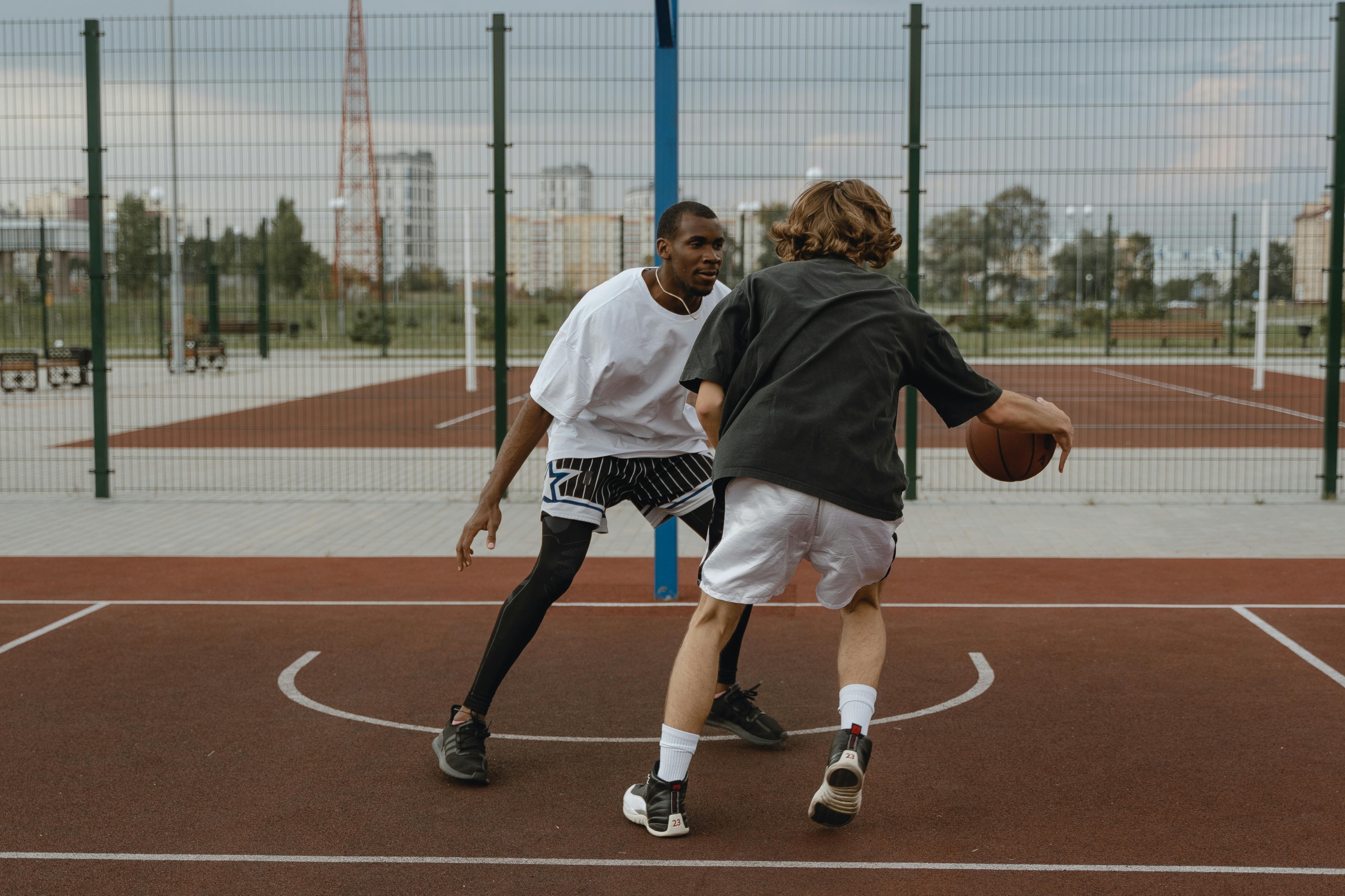 Photo by Tima Miroshnichenko: https://www.pexels.com/photo/friends-playing-basketball-5586376/