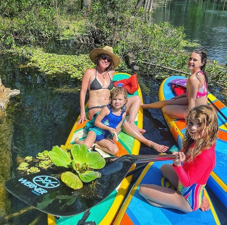 children on paddle boards