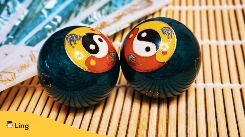 Chinese meditation balls and a fan
