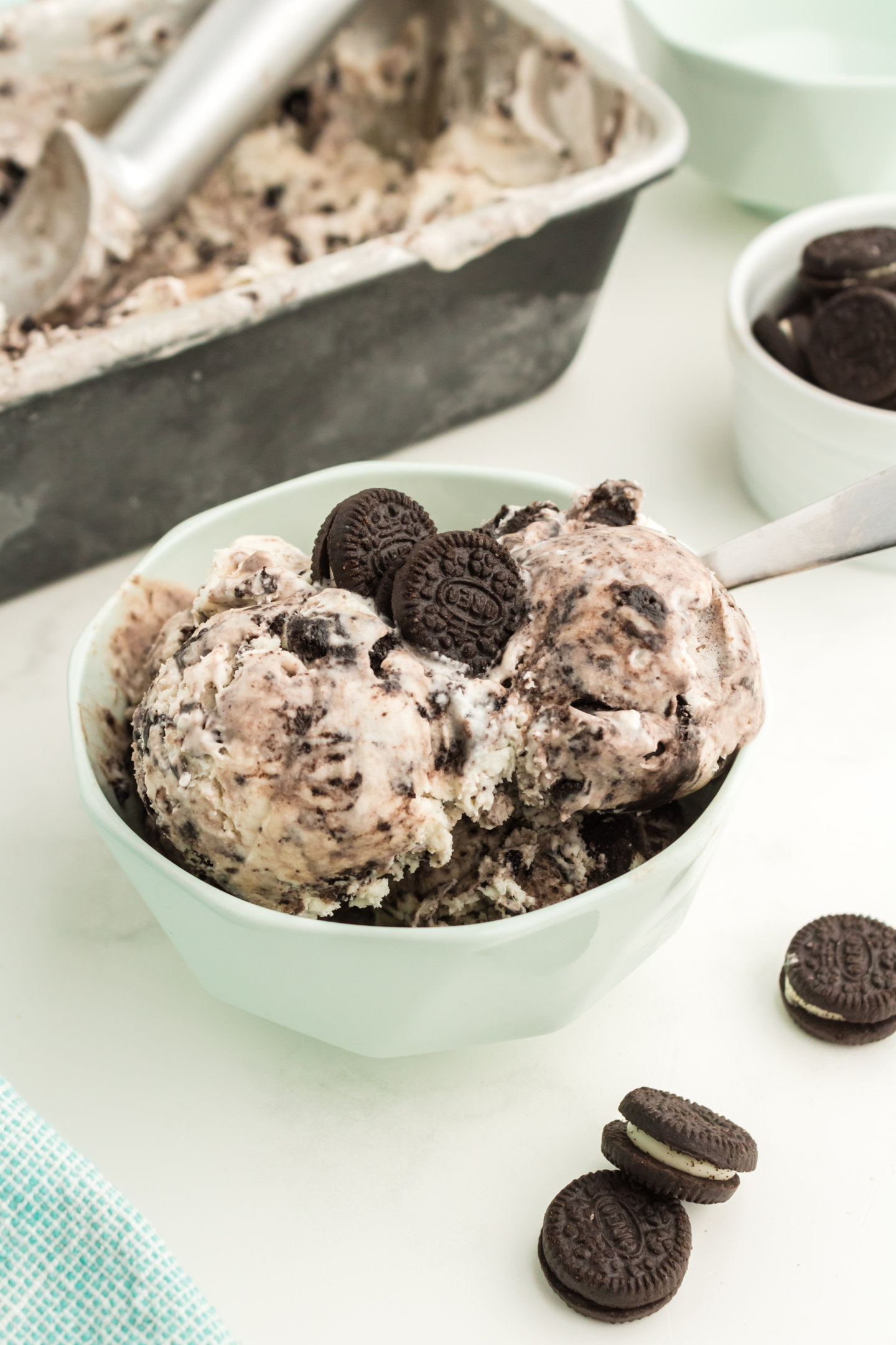 bowl of cookies and cream ice cream topped with mini Oreo cookies