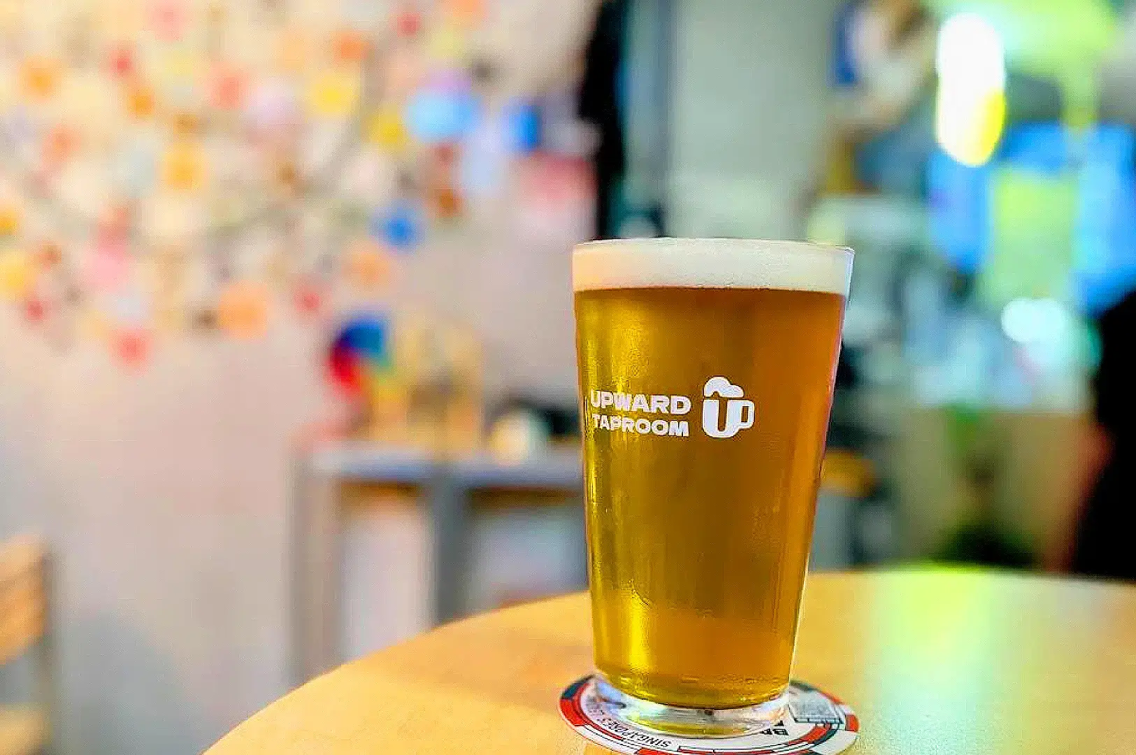 Upward Taproom Singapore craft beer pint served in branded glass