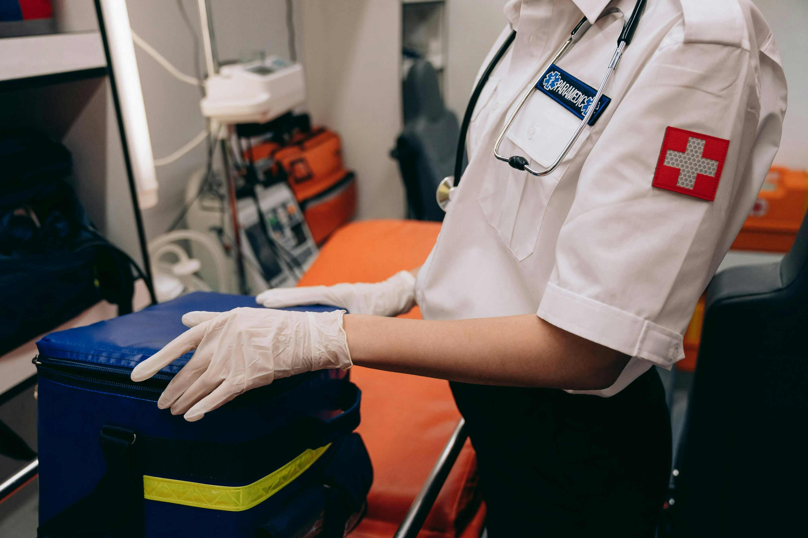 Paramedic with a a stretcher in an ambulance.