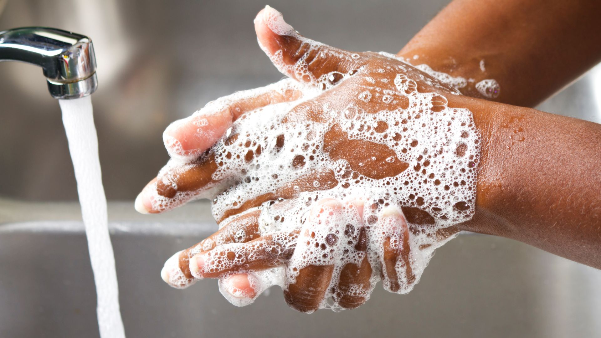 An image of a person washing their hands