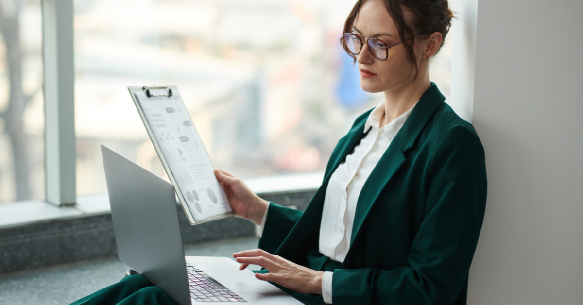 Woman filing taxes after learning the difference between C Corp and S Corp business structures