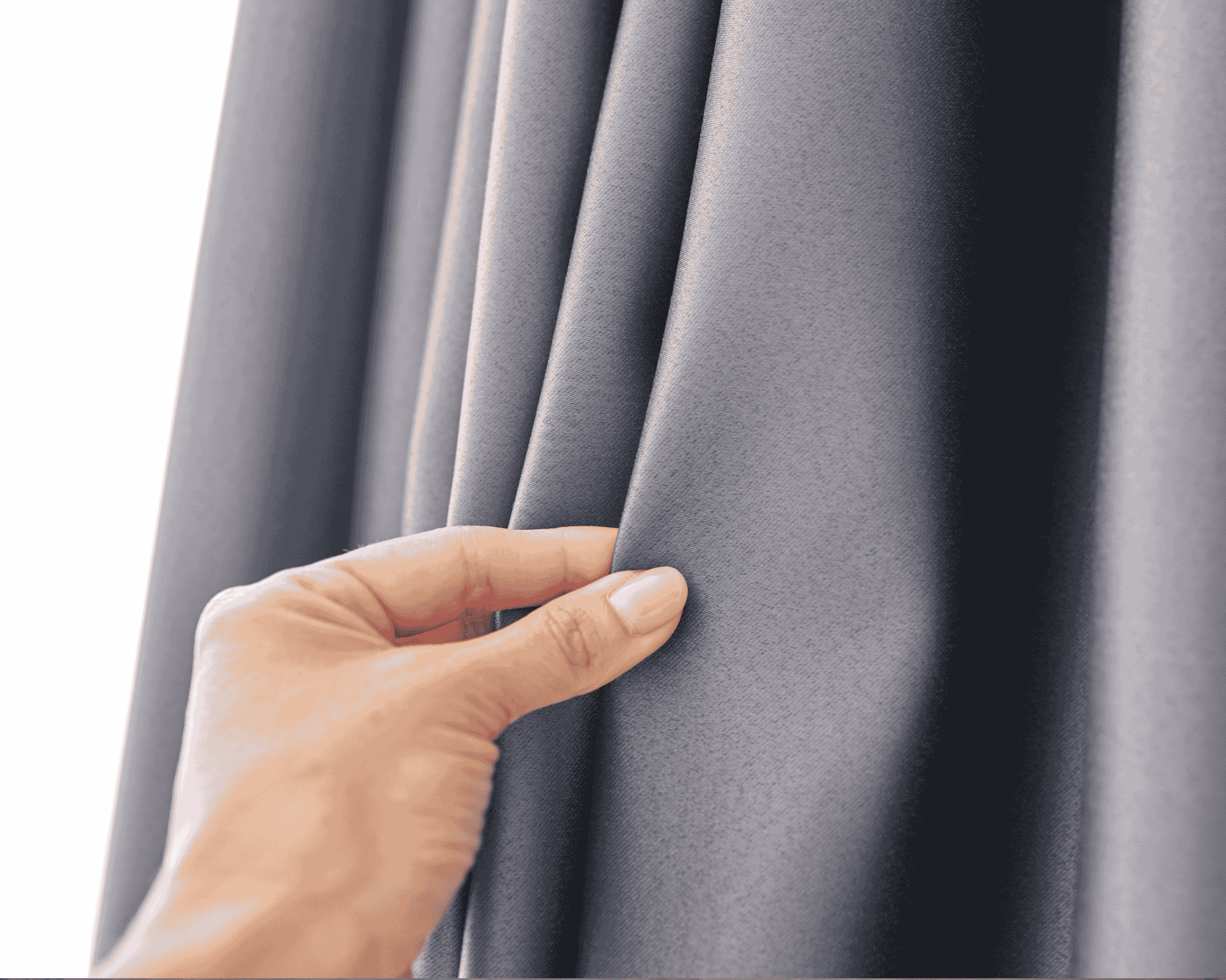 Close-up of a hand touching grey curtain fabric, representing professional curtain cleaning and fabric care services.