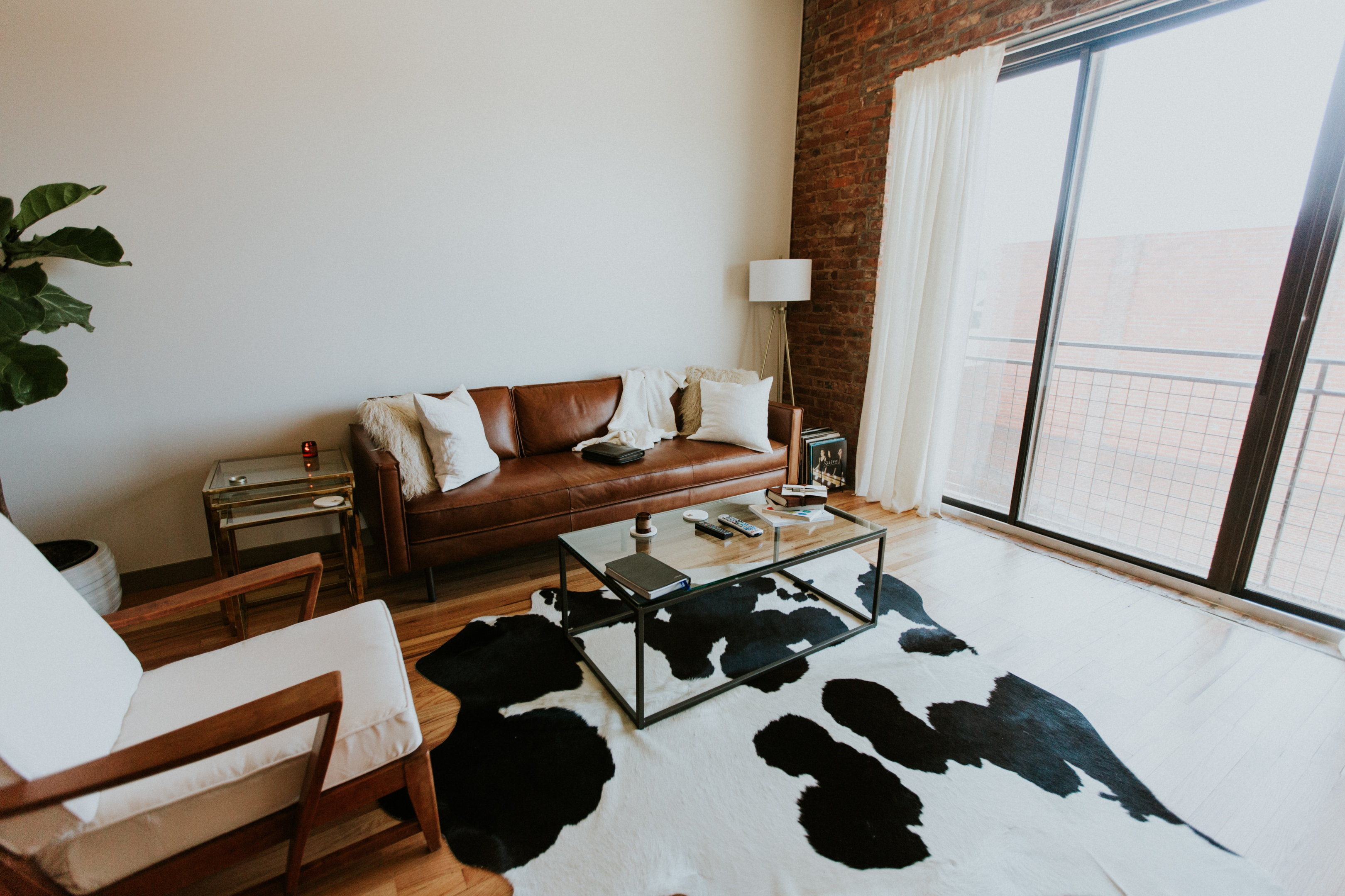 A stylish, modern living room with minimal, somewhat neutral decor—a good example of a staging job. 