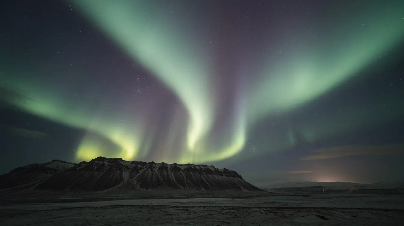 8db14b83 3203 4b55 88c5 e38113d2fa48 The image captures a stunning northern aurora borealis, showcasing vibrant green and purple bands illuminating a dark sky above a silhouetted mountain ridge. This breathtaking natural phenomenon would make for a perfect gift when printed on professional grade photo paper, preserving cherished moments in vivid detail.