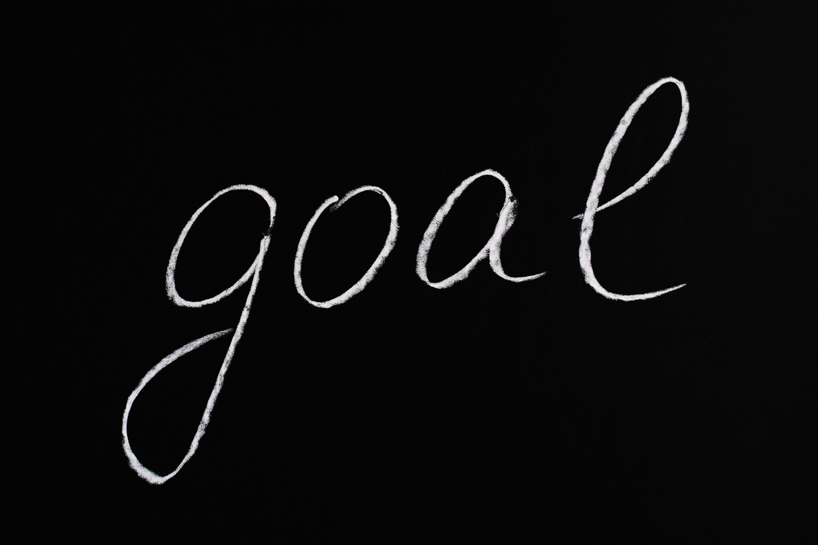Letter Goal written on a blackboard.