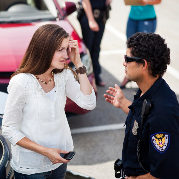 Image showing a person giving a statement to police at a truck accident scene in Duluth.