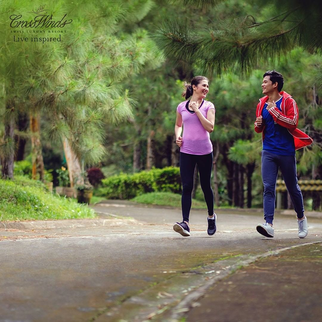 Image of 2 people jogging inside the luxury community of Crosswinds Tagaytay
