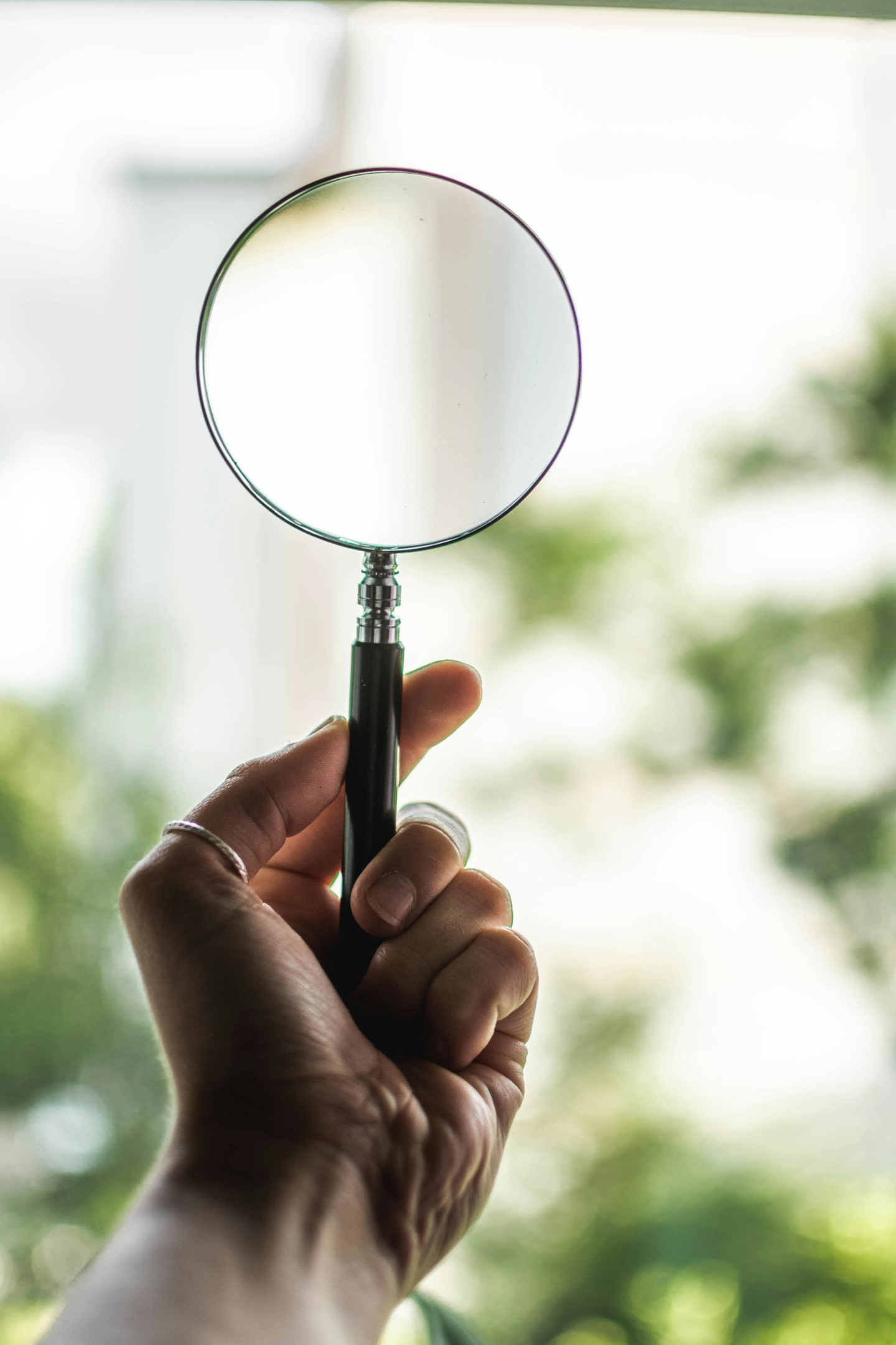holding magnifying glass