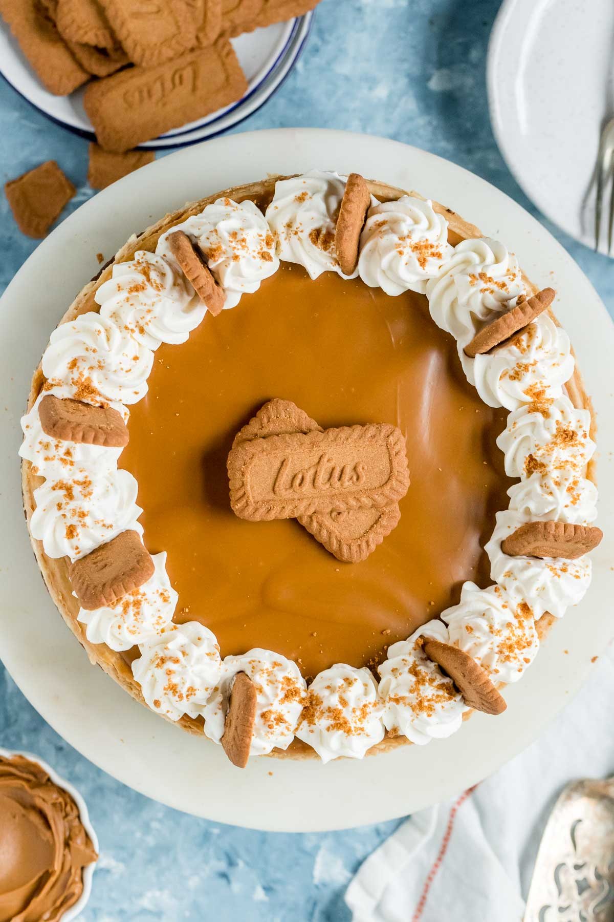 whole biscoff cheesecake on a cake stand